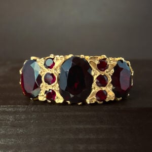 Pre-Loved Oval Trilogy Garnet Ring 9k Yellow Gold | 30777