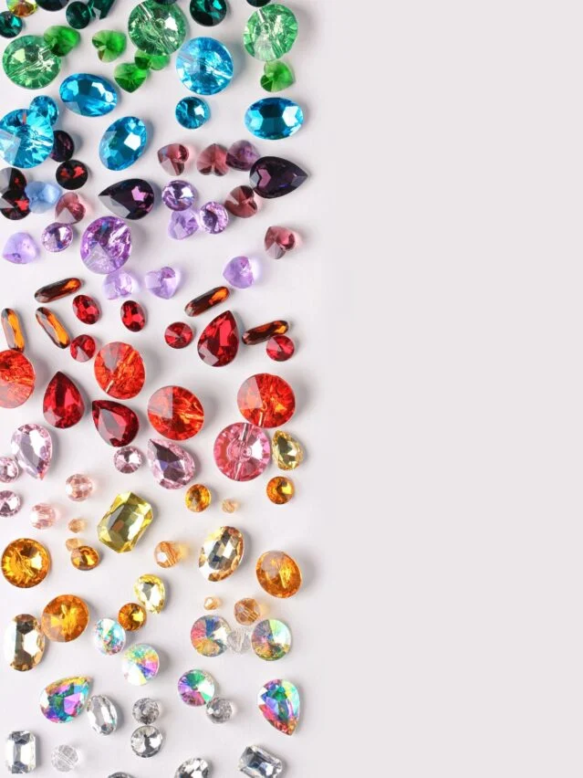 Complete Birthstone Guide - scattered gems in a variety of colours